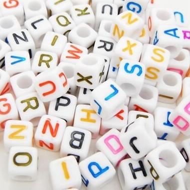 Pony beads with rainbow colored letters.