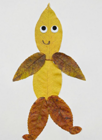 Person made out of leaves with googly eye face